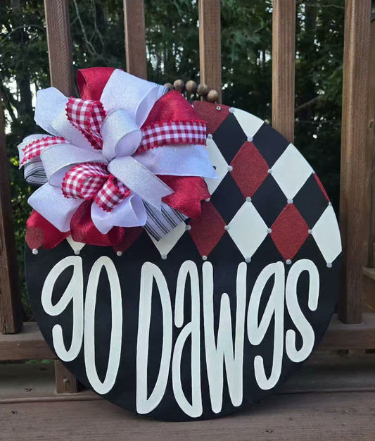 Hand-painted Georgia Dawgs door hanger in red, black and white with argyle pattern and layered ribbon bow